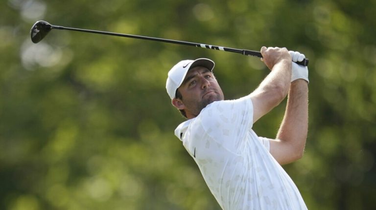Scottie Scheffler watches his shot from the 18th tee at the Memorial Tournament