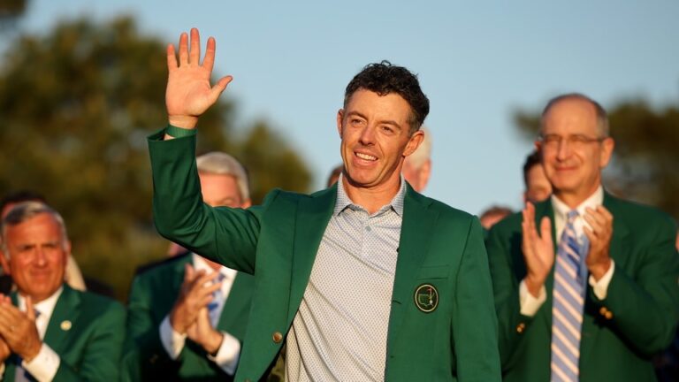 Rory McIlroy of Northern Ireland reacts after being awarded the Green Jacket during the Green Jacket Ceremony after winning during the final round of the 2026 Masters Tournament at Augusta National Golf Club