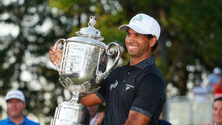 Aaron Rai raises the Wanamaker Trophy