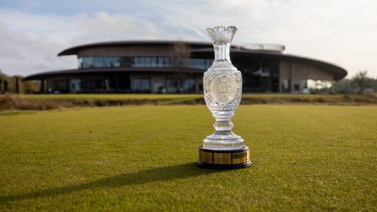 Solheim Cup trophy displayed on the golf course at Bernardus Golf Club in the Netherlands with the clubhouse in the background